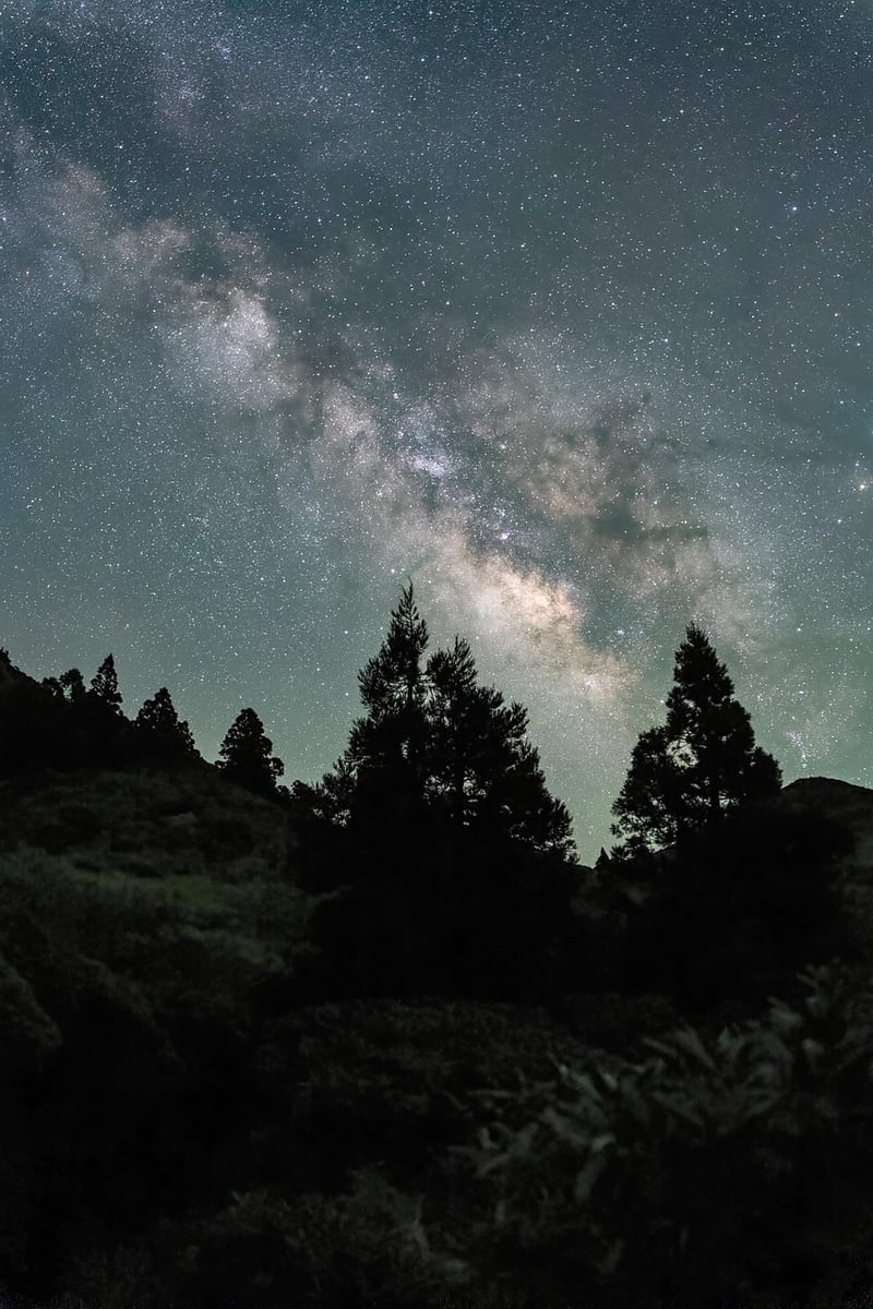 Person meditating under the night sky